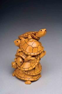 Carve a Tower of Teetering Turtles