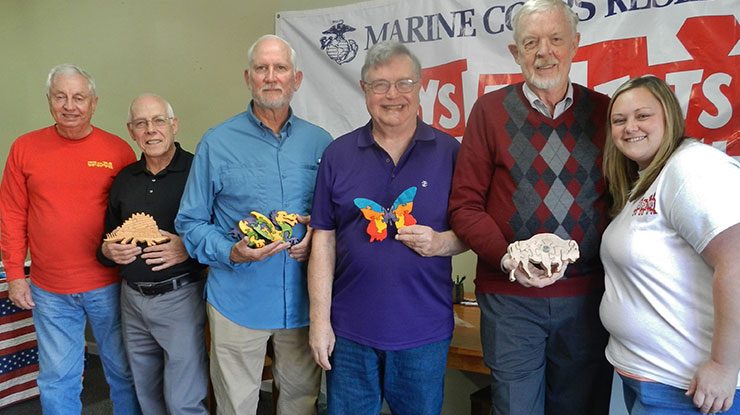 Pictured are Chuck Fleming of Toys for Tots, Claude Drevet, Terry Nicholson, Brian Beals, Cecil Schneider, and Amy Brannon-Hamby of Toys for Tots.