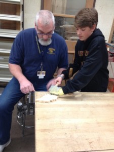 Hermantown Middle School Industrial Arts Teacher Wally Michelizzi with carving club member Noah Strecker